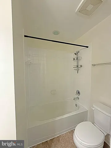 a view of an empty room with a glass door