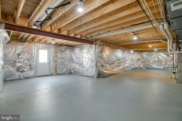 a view of house with outdoor space and parking