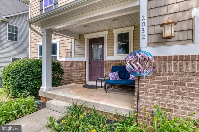 a view of a house with a yard patio and a swimming pool