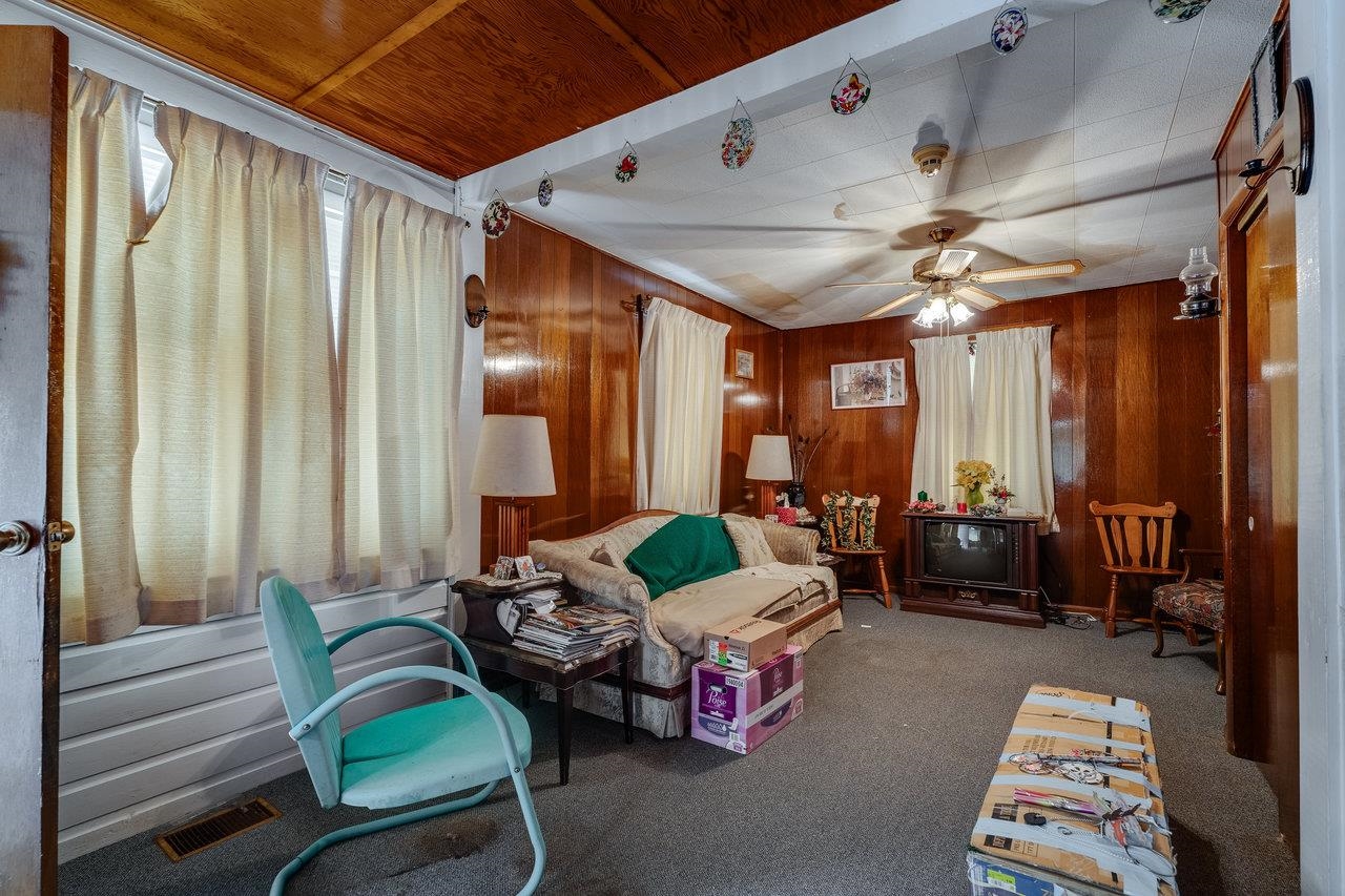 7049 Cross Keys Road Mount Crawford, VA 22841 - Photo 19 of 49 a living room with furniture and a chandelier