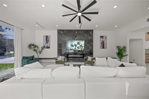 a spacious bedroom with a large bed and a window