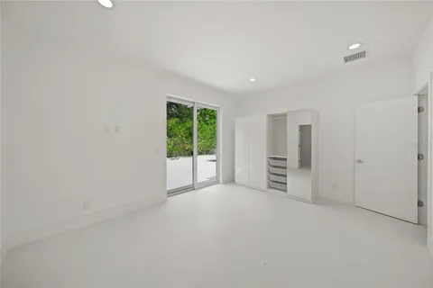 a large kitchen with stainless steel appliances granite countertop a refrigerator and a stove