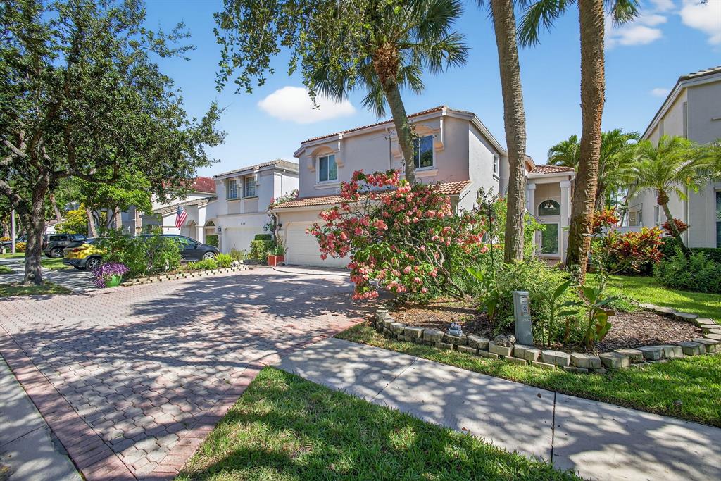 2119 Chagall Circle West Palm Beach, FL 33409 - Photo 3 of 63 a front view of house with yard and green space