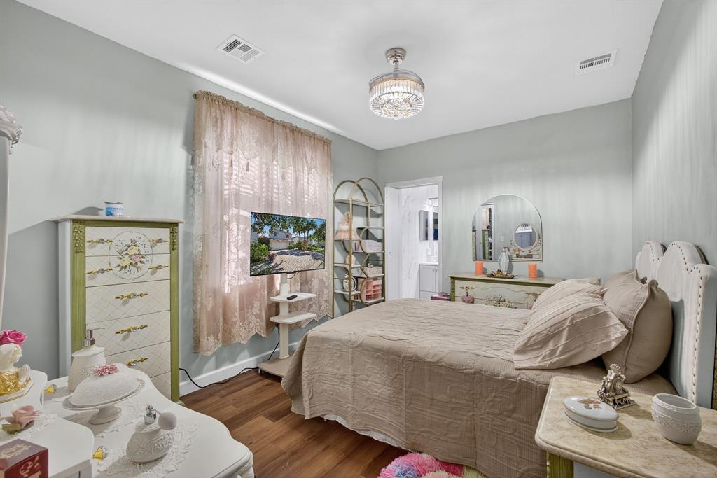 2119 Chagall Circle West Palm Beach, FL 33409 - Photo 31 of 63 a bedroom with a bed and a chair