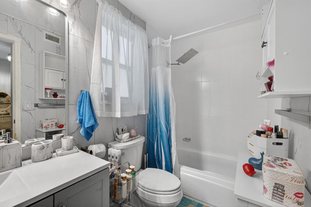 2119 Chagall Circle West Palm Beach, FL 33409 - Photo 34 of 63 a bathroom with a sink toilet and shower