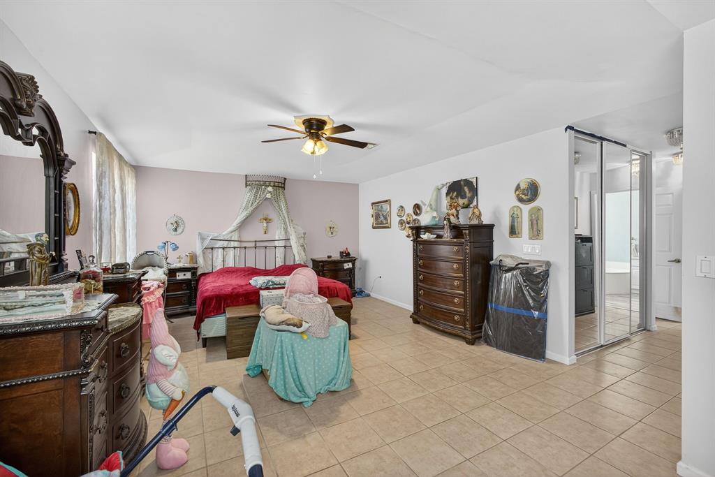 2119 Chagall Circle West Palm Beach, FL 33409 - Photo 40 of 63 a living room with furniture and a flat screen tv
