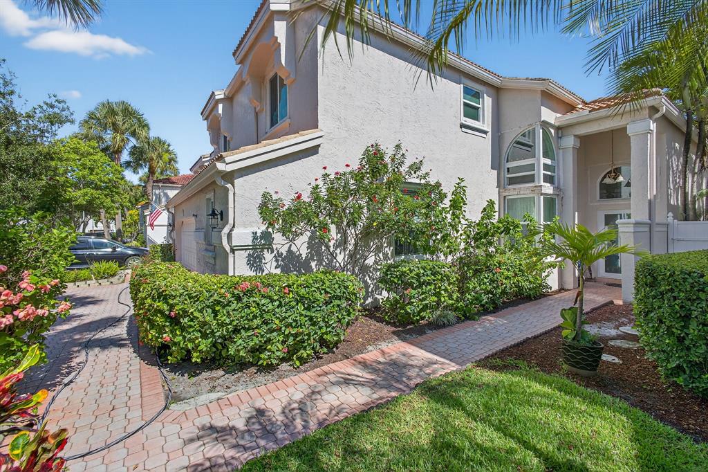 2119 Chagall Circle West Palm Beach, FL 33409 - Photo 4 of 63 a front view of a house with a yard