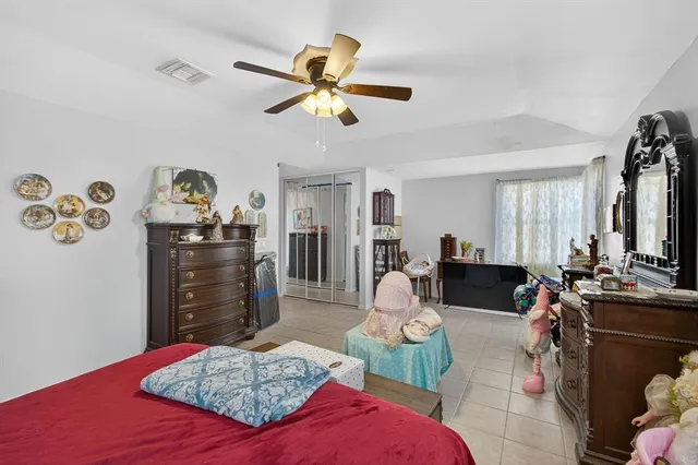 a bed room with a bed and a window