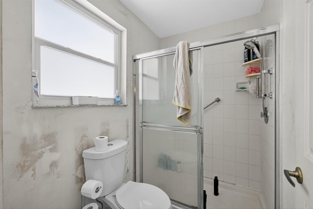 2119 Chagall Circle West Palm Beach, FL 33409 - Photo 45 of 63 a bathroom with a toilet and a shower