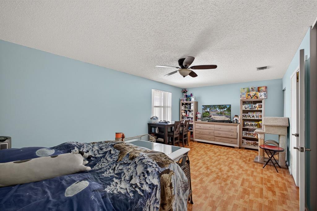 2119 Chagall Circle West Palm Beach, FL 33409 - Photo 47 of 63 a bed room with a bed furniture and a window