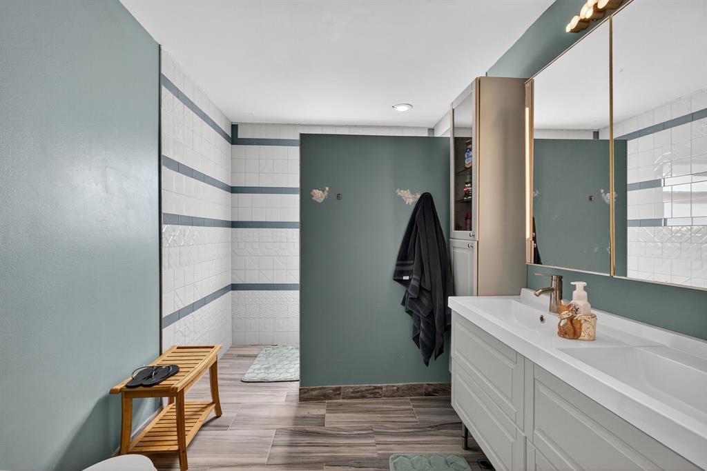 2119 Chagall Circle West Palm Beach, FL 33409 - Photo 48 of 63 a bathroom with a sink and mirror