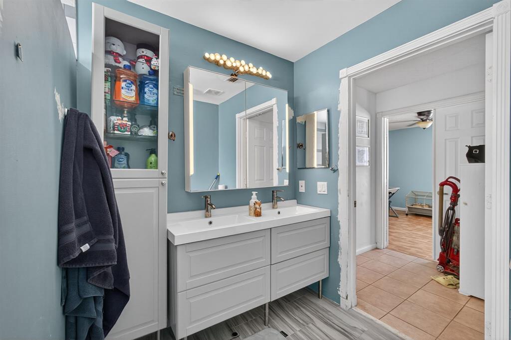 2119 Chagall Circle West Palm Beach, FL 33409 - Photo 50 of 63 a bathroom with a sink vanity and mirror