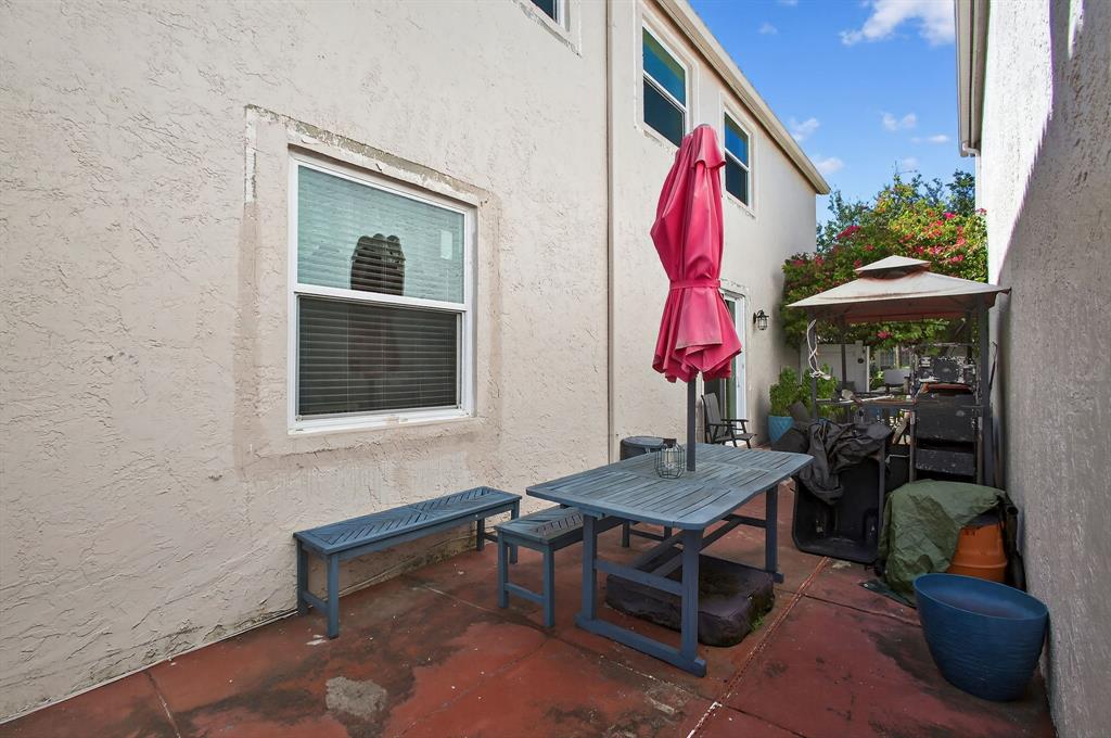 2119 Chagall Circle West Palm Beach, FL 33409 - Photo 56 of 63 a view of a house with backyard and sitting area