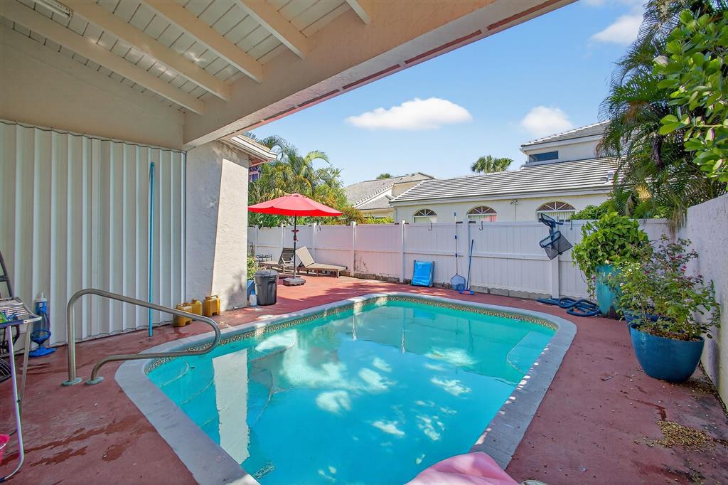 2119 Chagall Circle West Palm Beach, FL 33409 - Photo 62 of 63 a view of swimming pool with seating area