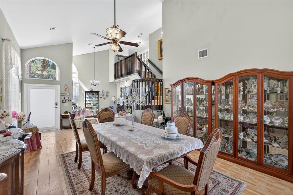 2119 Chagall Circle West Palm Beach, FL 33409 - Photo 9 of 63 a view of a dining room and livingroom with furniture wooden floor a chandelier