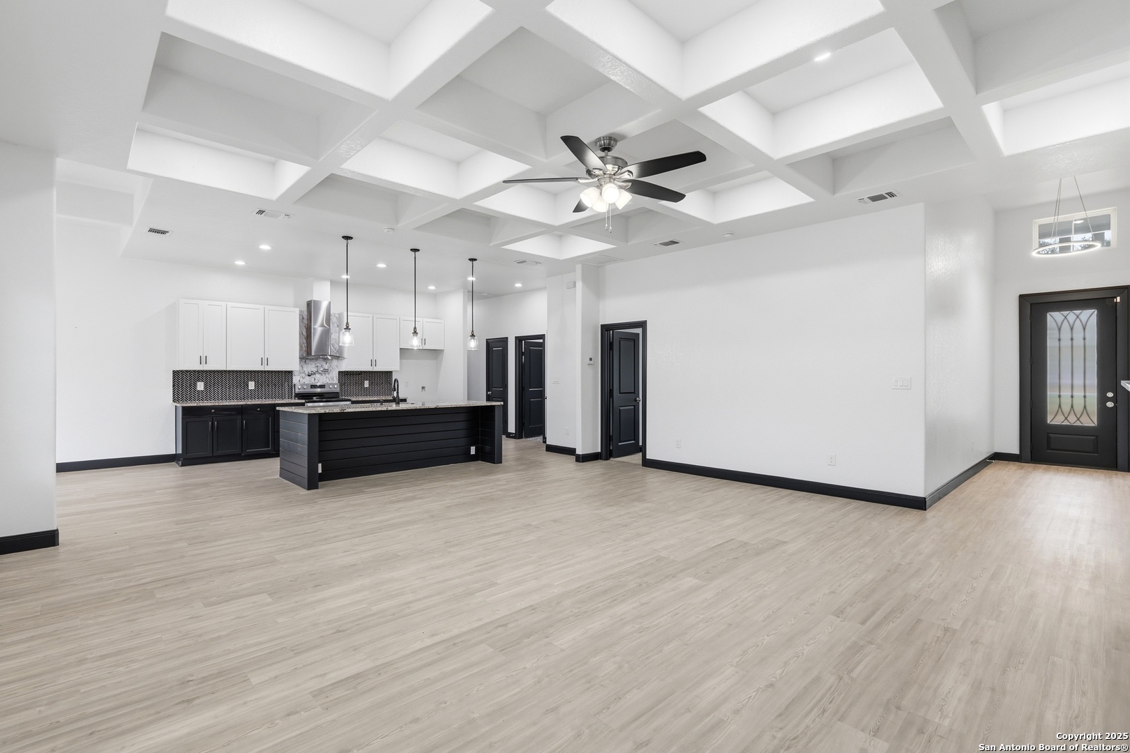 128 Hidden Ranch Court Floresville, TX 78114 - Photo 11 of 38 a view of a kitchen with a sink and a large window