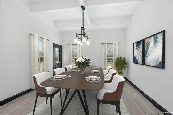 a view of a dining room with furniture window and wooden floor