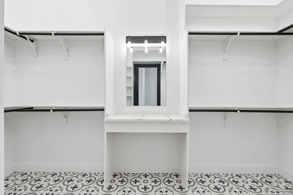 a view of walk in closet with window