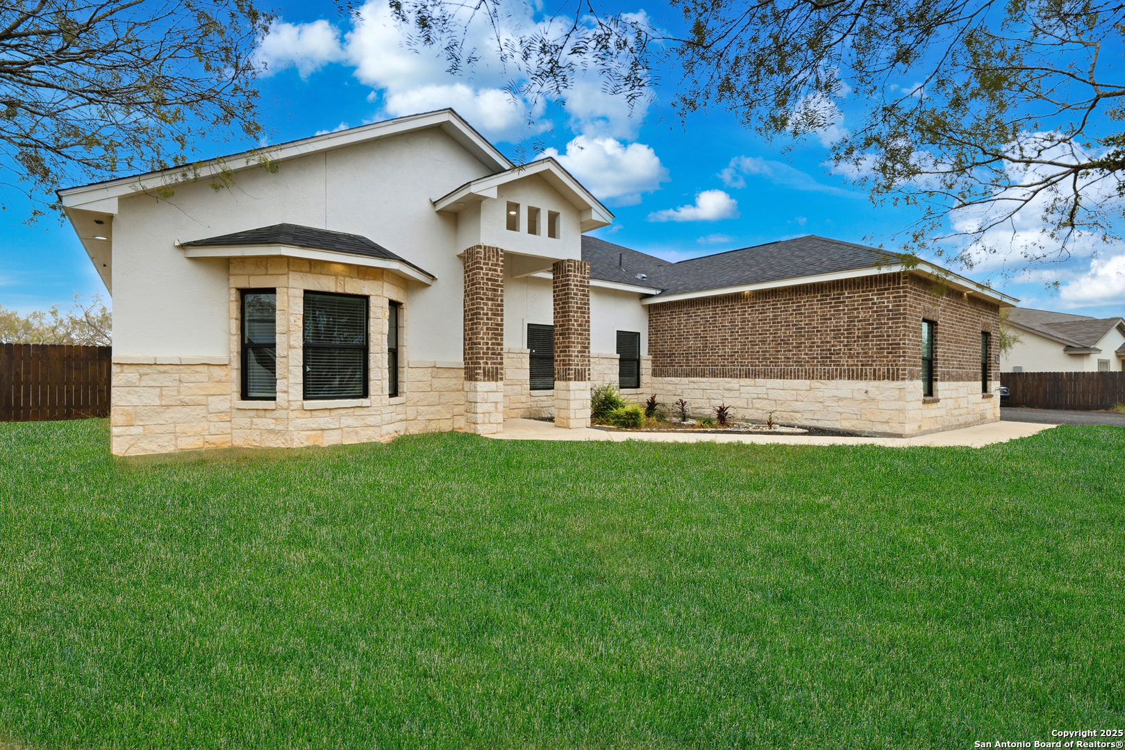 128 Hidden Ranch Court Floresville, TX 78114 - Photo 4 of 38 a front view of a house with a yard
