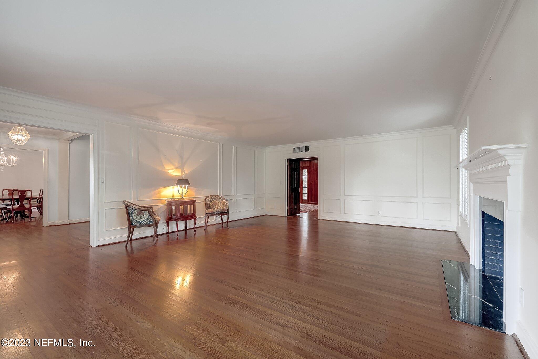 4143 Sherwood Road Jacksonville, FL 32210 - Photo 12 of 67 a view of empty room with wooden floor