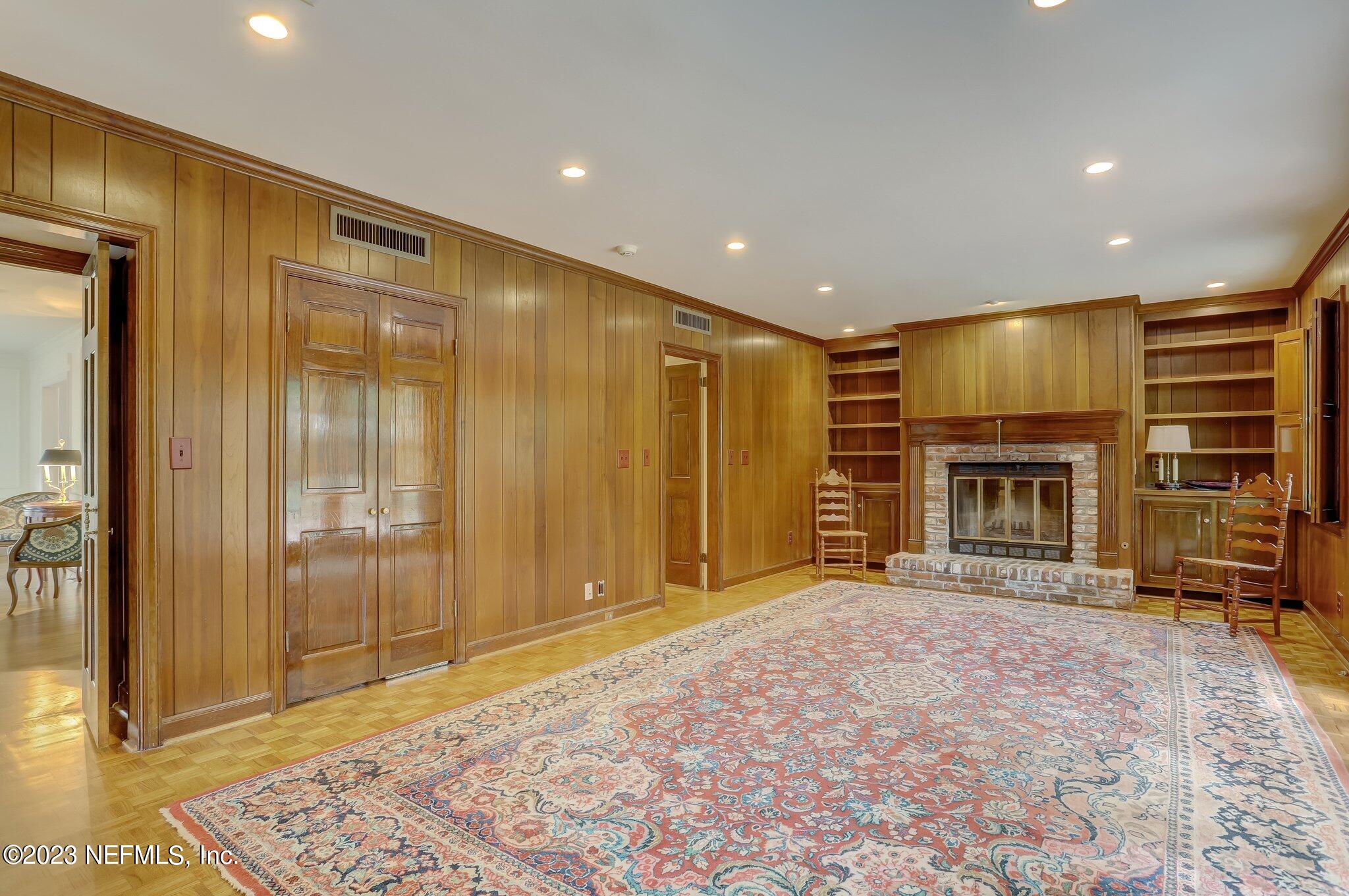 4143 Sherwood Road Jacksonville, FL 32210 - Photo 15 of 67 a view of an empty room with a fireplace