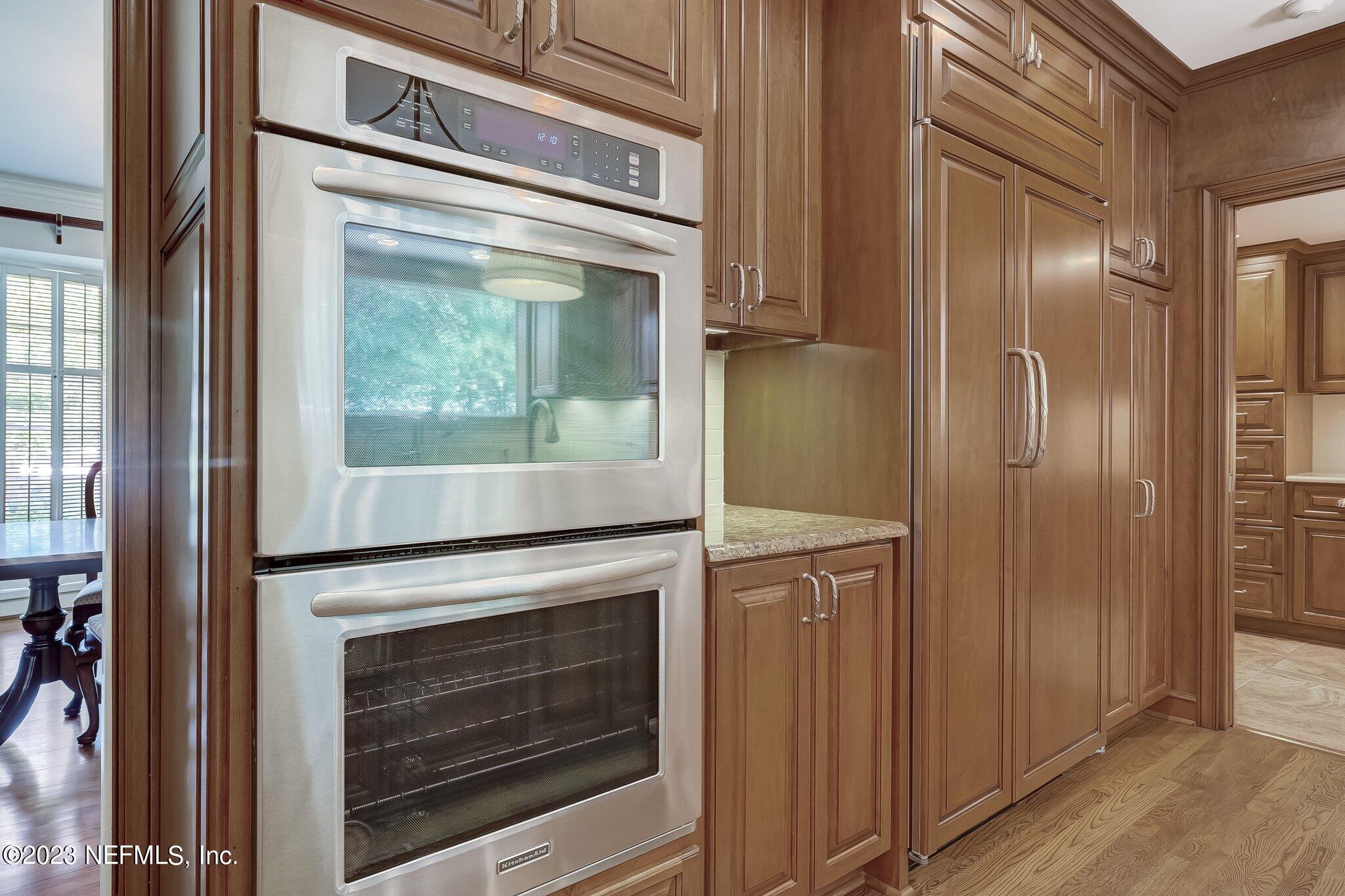 4143 Sherwood Road Jacksonville, FL 32210 - Photo 18 of 67 a stove top oven sitting inside of a kitchen