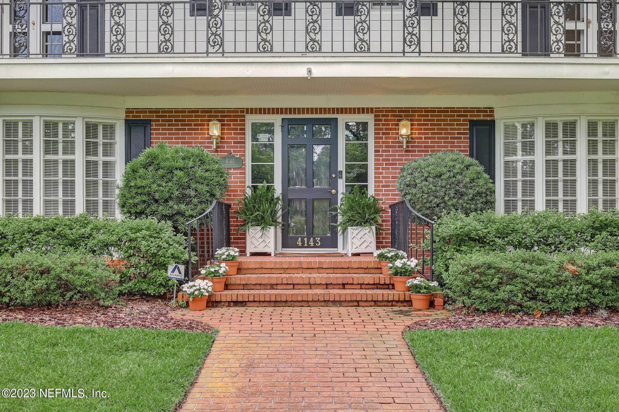 4143 Sherwood Road Jacksonville, FL 32210 - Photo 2 of 67 a front view of a house with a yard