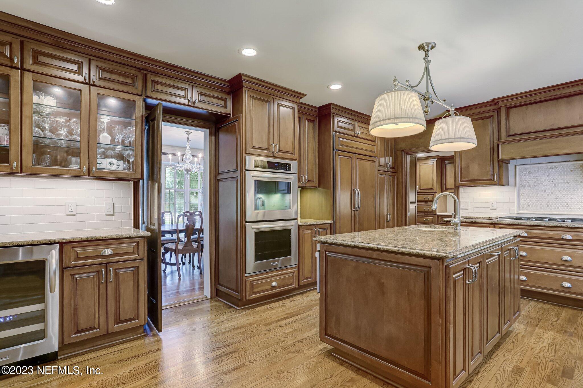 4143 Sherwood Road Jacksonville, FL 32210 - Photo 22 of 67 a kitchen with stainless steel appliances granite countertop a stove and a refrigerator