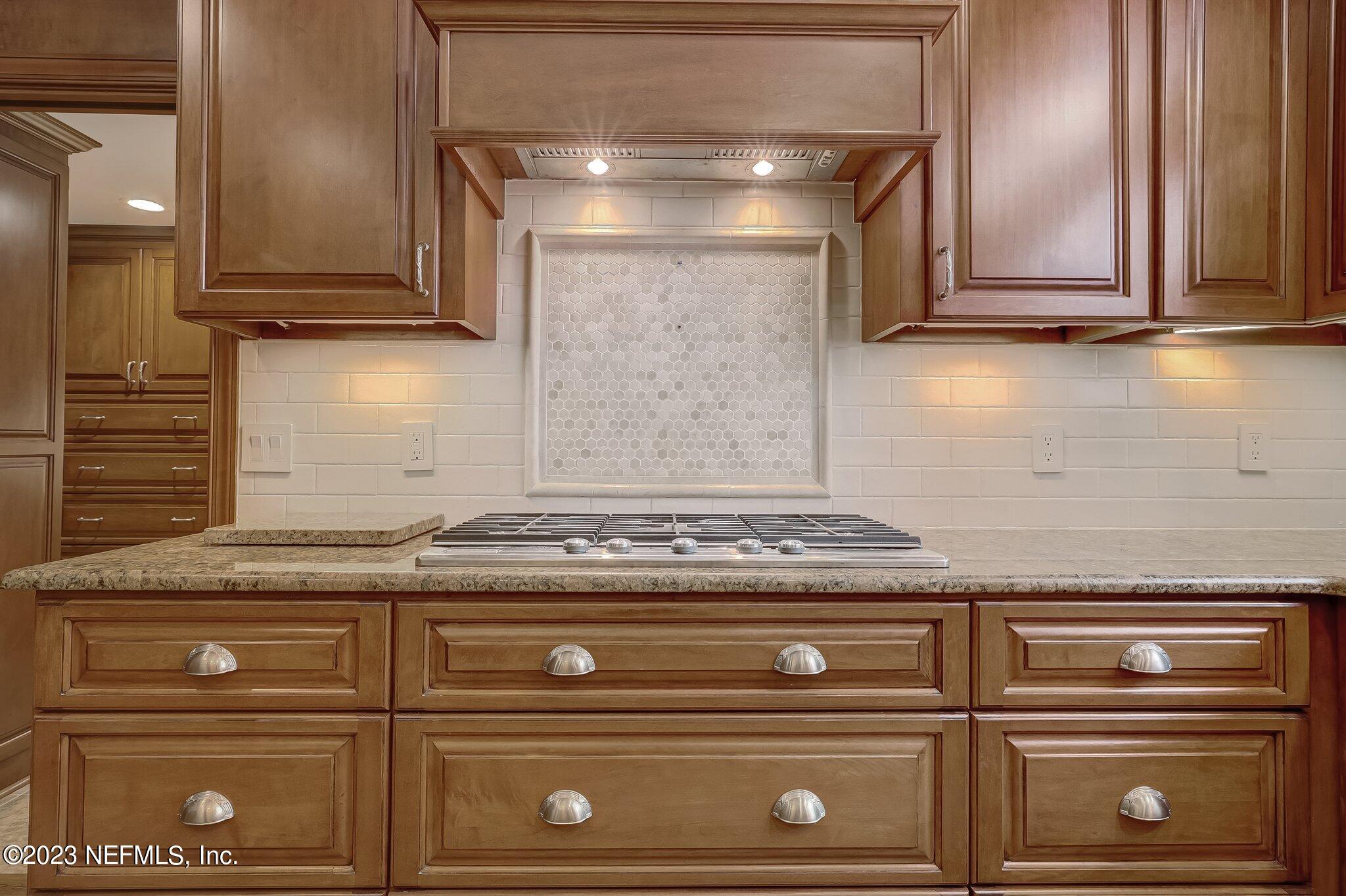 4143 Sherwood Road Jacksonville, FL 32210 - Photo 27 of 67 a stove top oven sitting inside of a kitchen