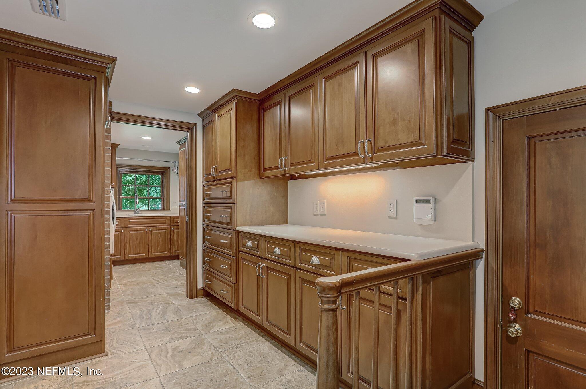 4143 Sherwood Road Jacksonville, FL 32210 - Photo 30 of 67 a kitchen with a refrigerator and a stove