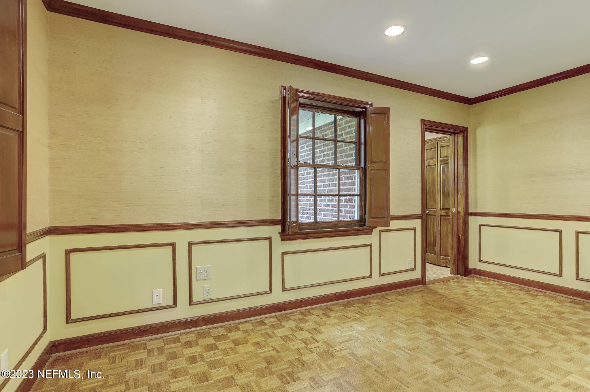 4143 Sherwood Road Jacksonville, FL 32210 - Photo 38 of 67 a view of an empty room with a window