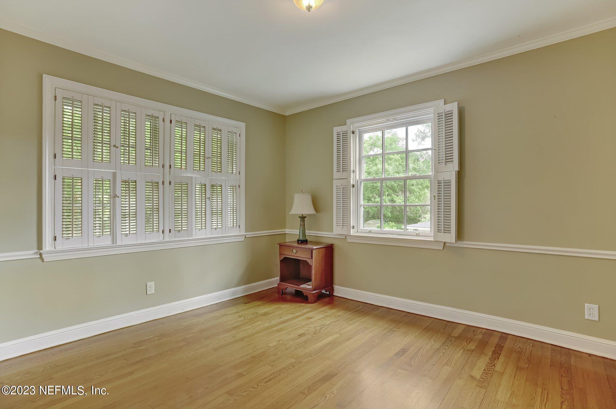 4143 Sherwood Road Jacksonville, FL 32210 - Photo 55 of 67 a view of a room with wooden floor and staircase