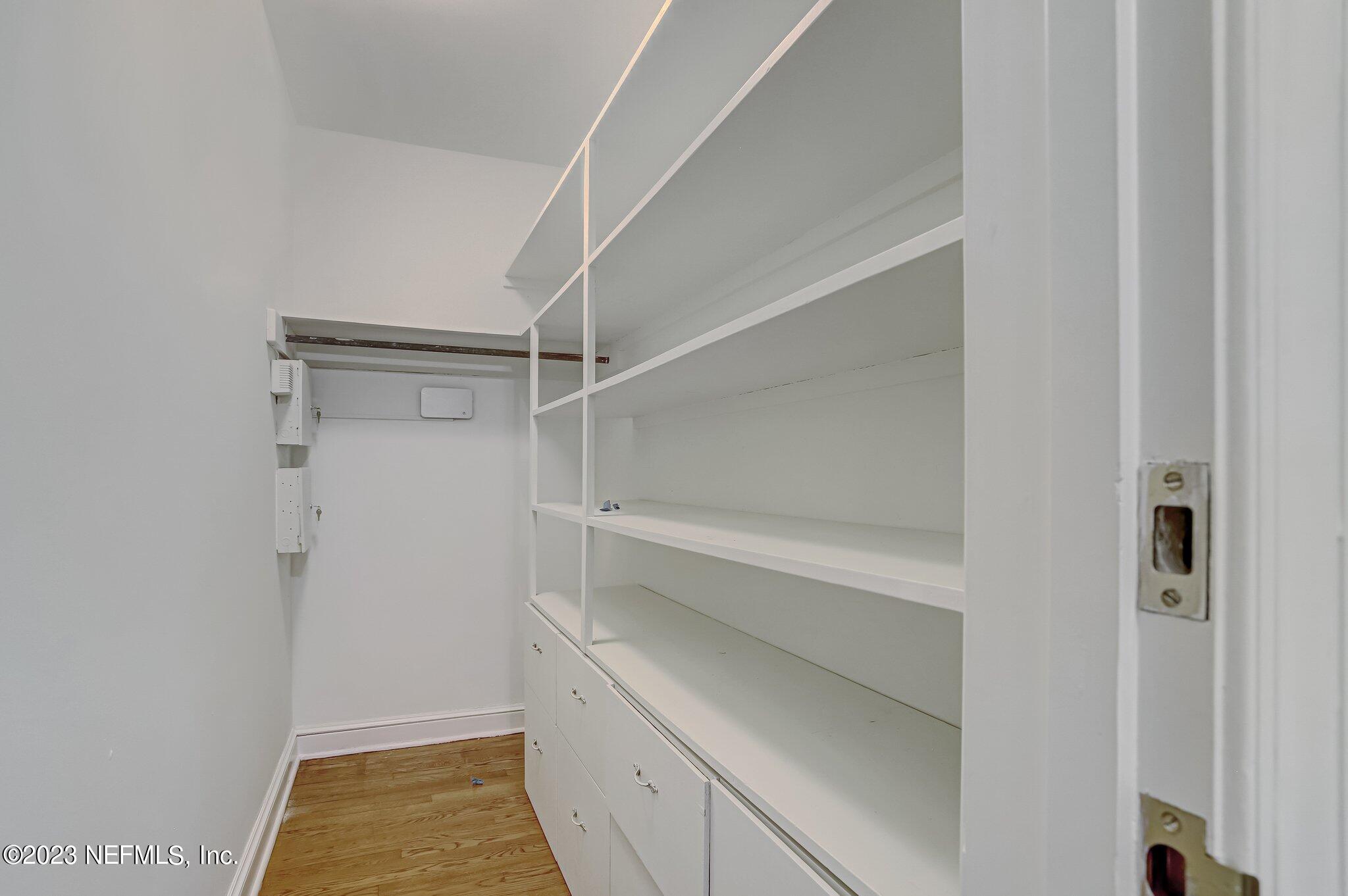 4143 Sherwood Road Jacksonville, FL 32210 - Photo 57 of 67 a view of walk in closet with empty racks