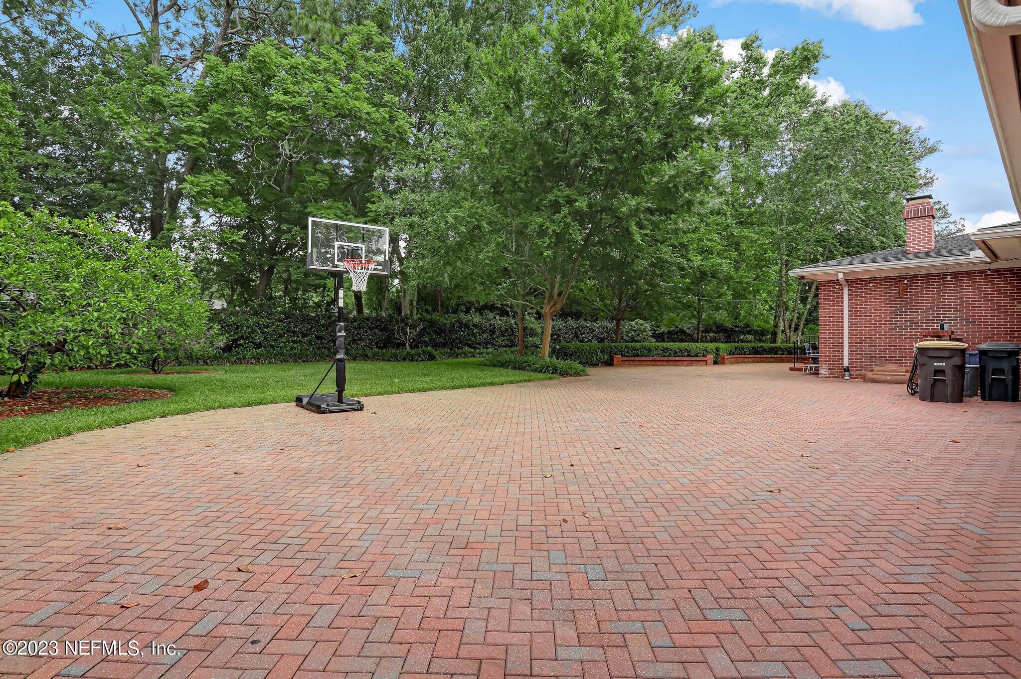 4143 Sherwood Road Jacksonville, FL 32210 - Photo 59 of 67 a view of a house with backyard and trees