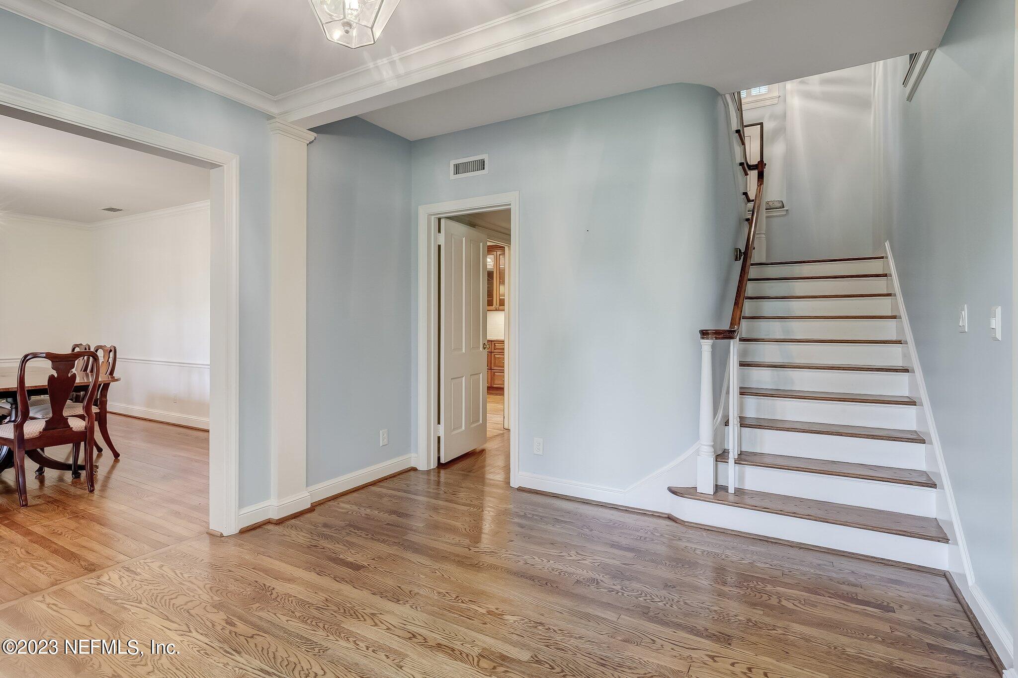 4143 Sherwood Road Jacksonville, FL 32210 - Photo 6 of 67 a view of a livingroom with wooden floor and stairs