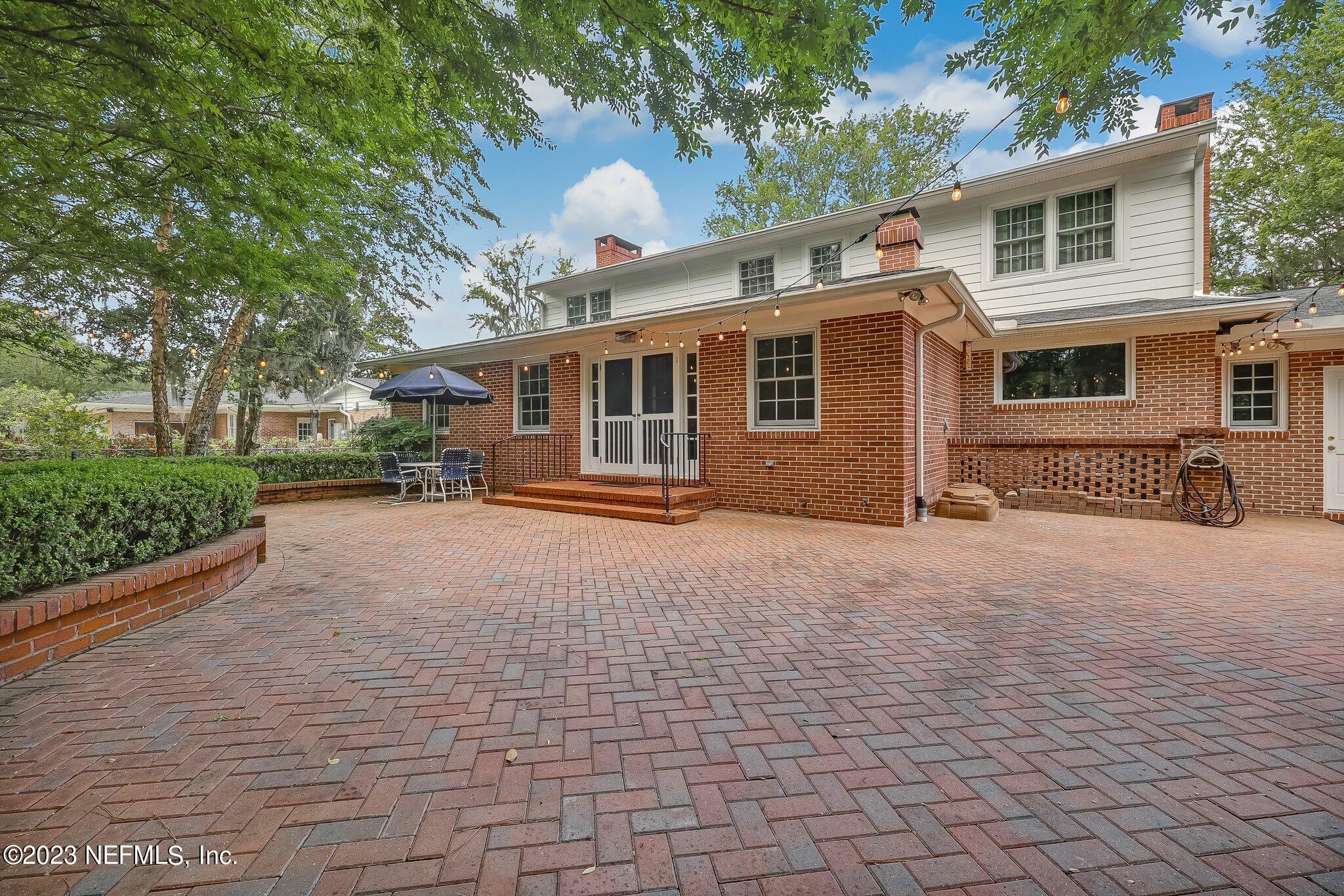 4143 Sherwood Road Jacksonville, FL 32210 - Photo 61 of 67 a front view of a house with a yard and garage
