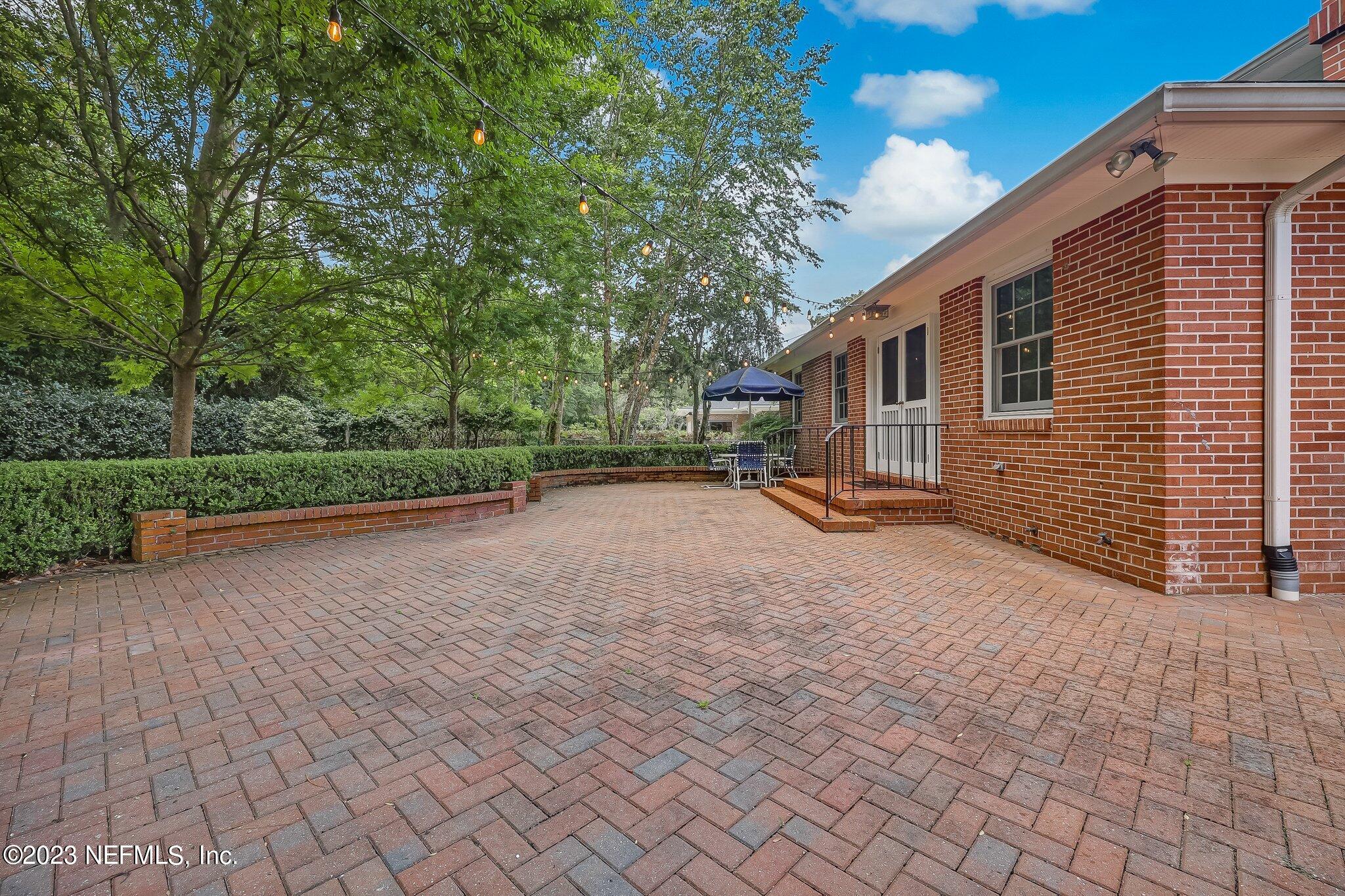 4143 Sherwood Road Jacksonville, FL 32210 - Photo 64 of 67 a view of a house with backyard and trees