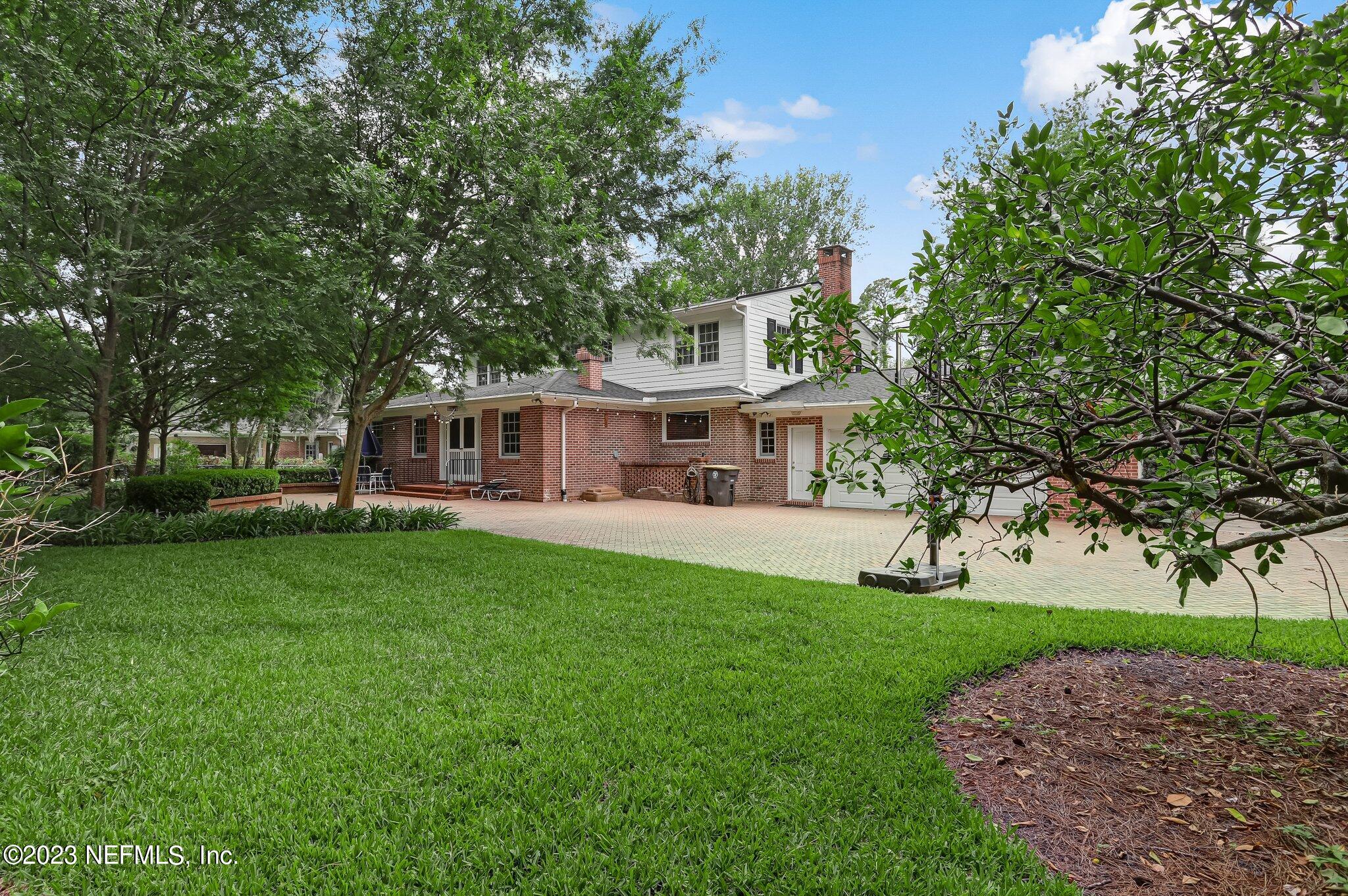 4143 Sherwood Road Jacksonville, FL 32210 - Photo 66 of 67 a front view of a house with a garden