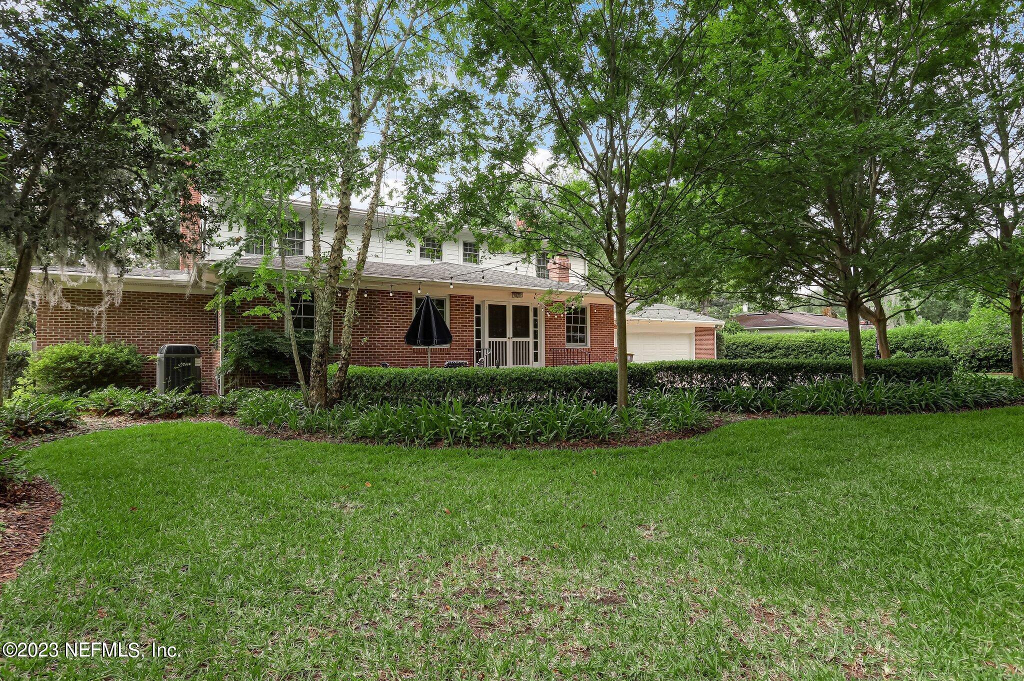4143 Sherwood Road Jacksonville, FL 32210 - Photo 67 of 67 a front view of a house with a yard