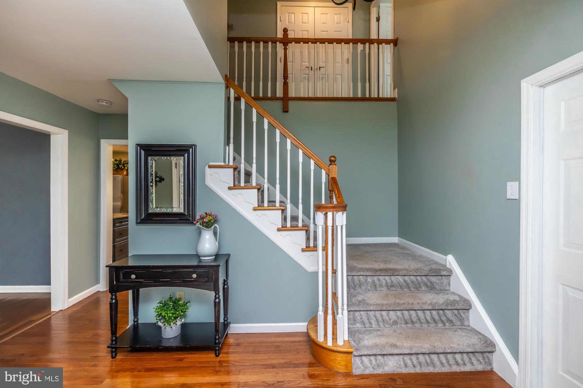 374 Devon Drive Exton, PA 19341 - Photo 15 of 50 a view of entryway and hall with wooden floor
