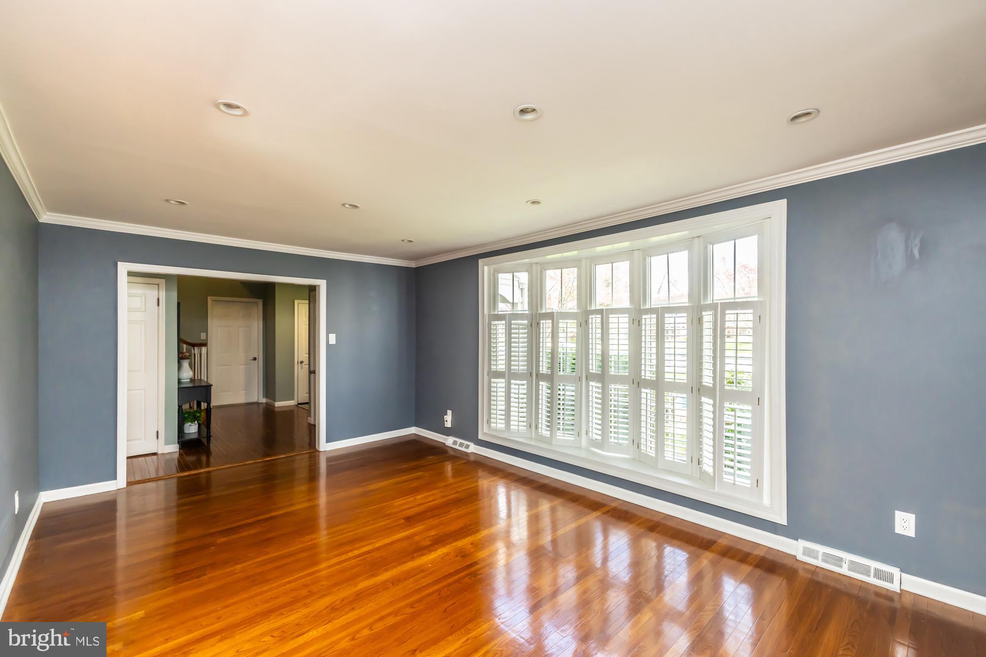 374 Devon Drive Exton, PA 19341 - Photo 18 of 50 a view of an empty room with wooden floor and a window