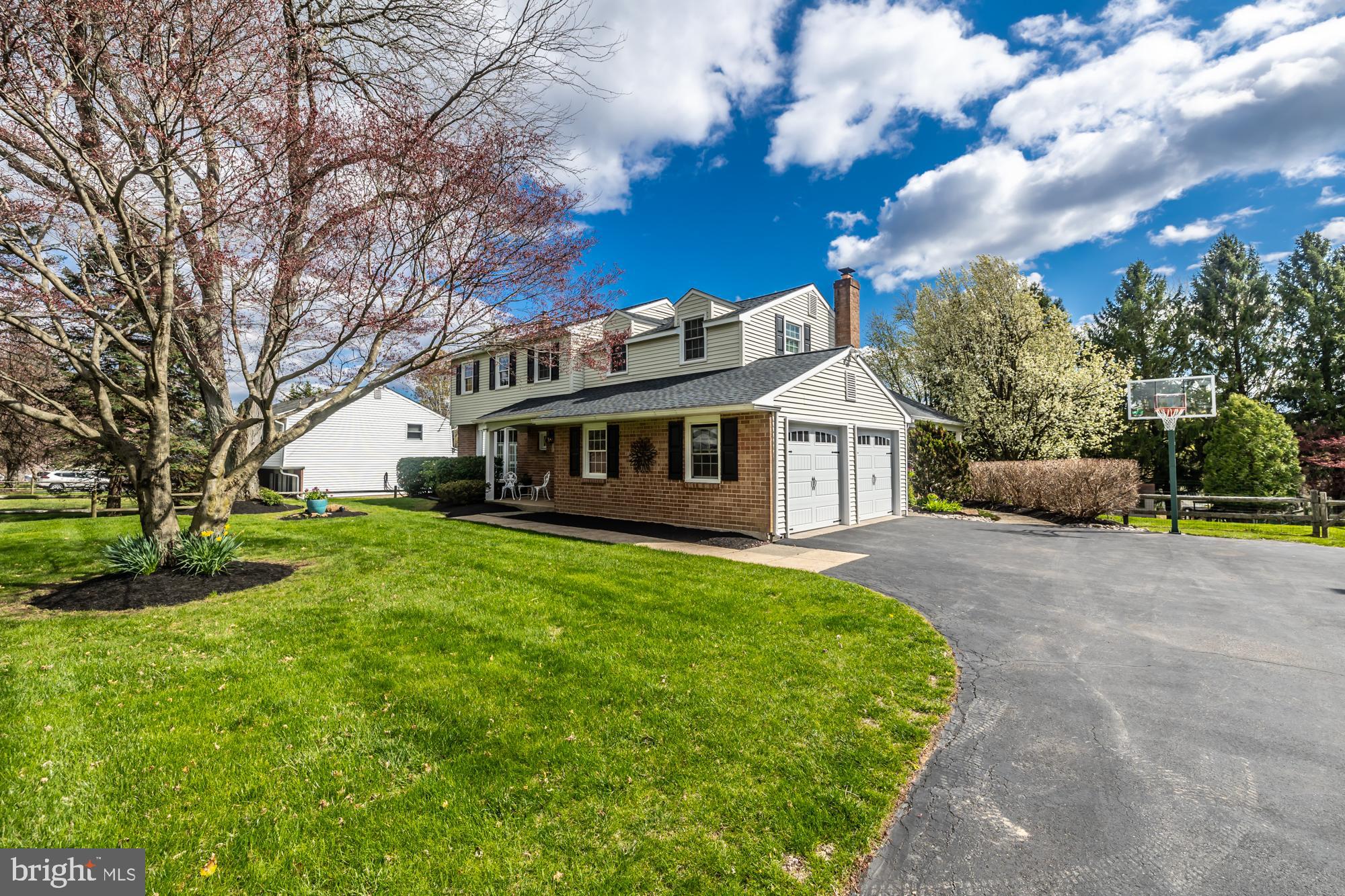 374 Devon Drive Exton, PA 19341 - Photo 4 of 50 a front view of a house with a garden