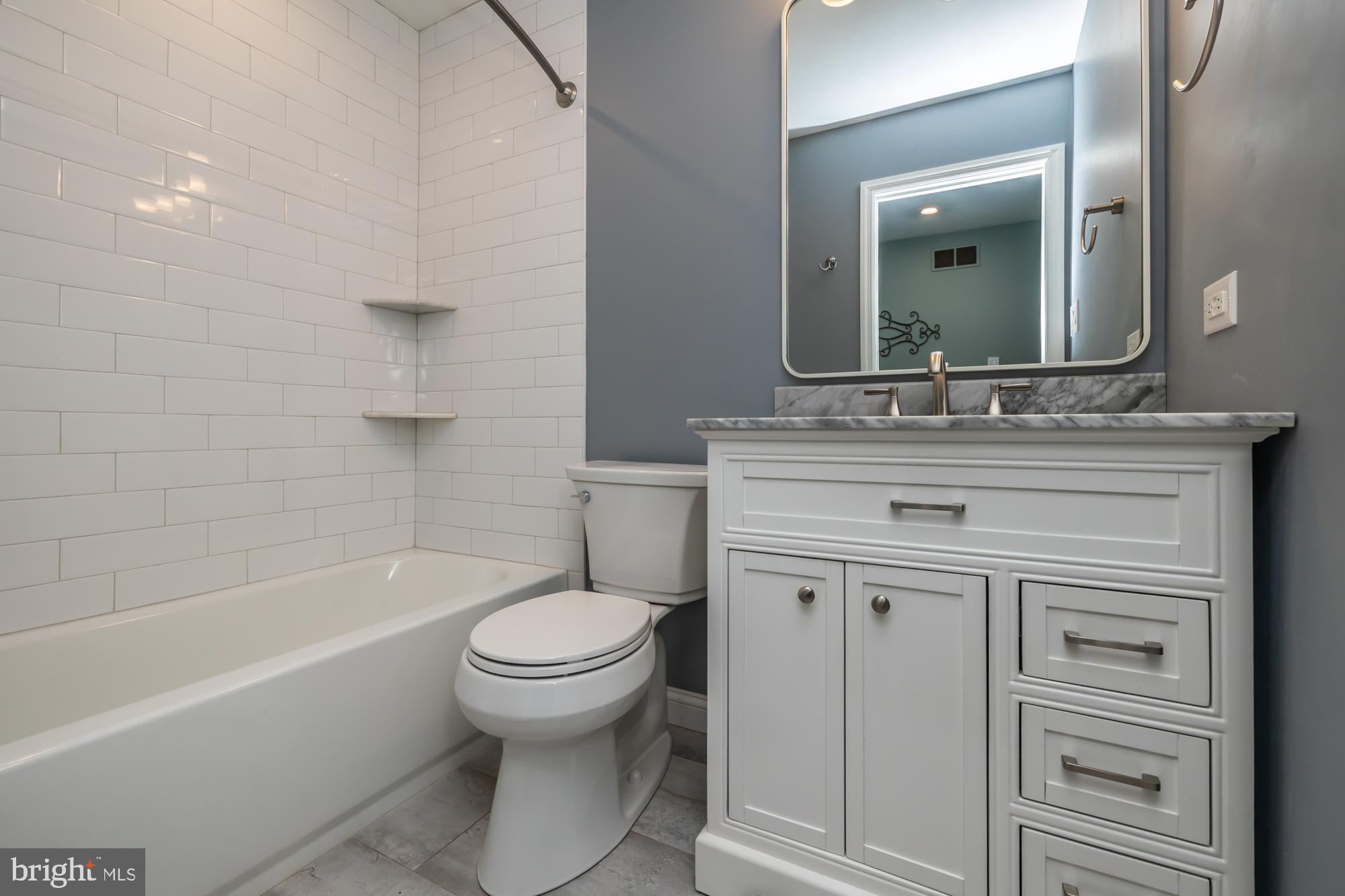 374 Devon Drive Exton, PA 19341 - Photo 43 of 50 a bathroom with a sink toilet vanity and bathtub