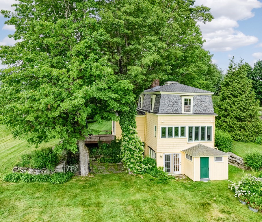 27 Worcester Road Princeton, MA 01541 - Photo 31 of 41 a view of a house with a yard and sitting area