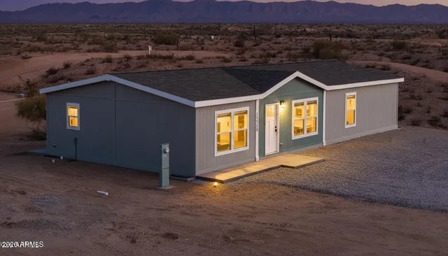 a kitchen with stainless steel appliances granite countertop a stove a refrigerator a sink a microwave and island