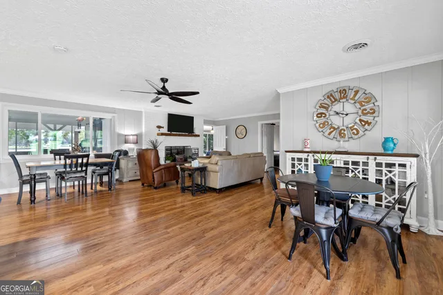 a bedroom with furniture and large windows