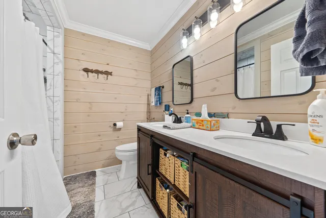 a bed room with a bed and a ceiling fan