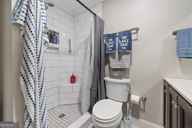 a large living room with kitchen island granite countertop furniture and a large window