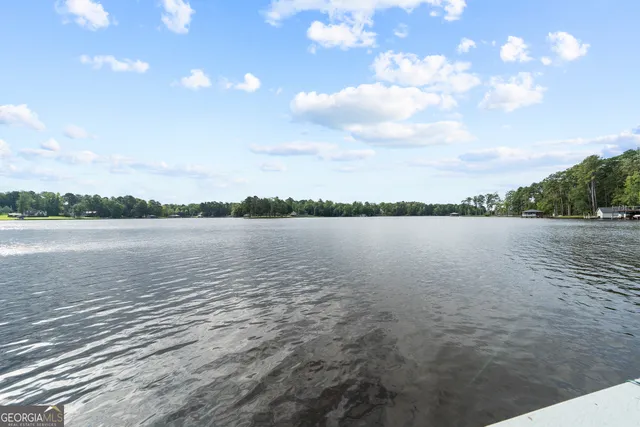 a front view of house with yard and outdoor seating