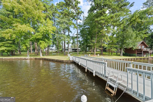 a view of a lake with a house in the background